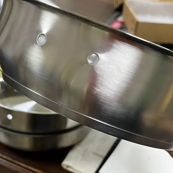 Eggscalibur SUS304 stainless steel frying pan body — riveted mounting points for the detachable sword handle